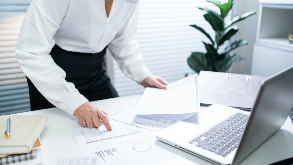 Auditor Business women checking annual financial statements of company. Audit Concept