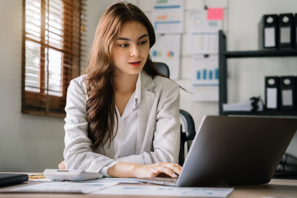 young asian business women working in the work area.